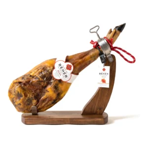 Beher Ibérico cebo de campo paleta (shoulder), whole and bone-in, on a wooden ham stand