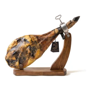 Cinco Jotas 100% Ibérico de bellota paleta (shoulder), whole and bone-in, on a wooden ham stand