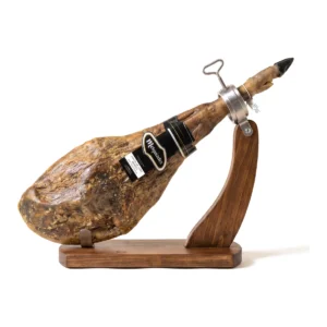 Melquiades 50% Ibérico Cebo de Campo ham, whole and bone-in, on a wooden ham stand
