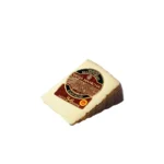 Manchego DOP Vega Mancha, curado 6 meses, cuña de 1 lb Queso Manchego DOP Vega Mancha curado de 5-6 meses, rueda entera de 7.5 lb